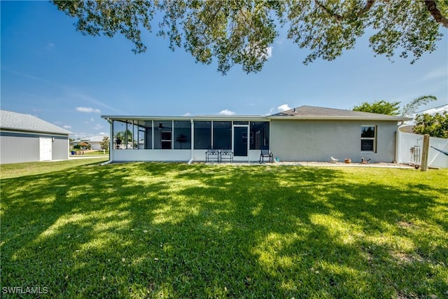 14160 Cedardale St, Fort Myers, FL 33905 - rear view of property with a sunroom and stucco siding