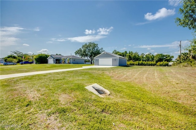 14160 Cedardale St, Fort Myers, FL 33905 - view of grassy yard with driveway and an outdoor structure