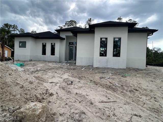 3346 10th Ave SE, Naples, FL 34117 - view of front facade featuring stucco siding
