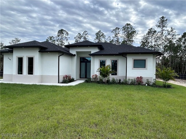 3346 10th Ave SE, Naples, FL 34117 - rear view of house with stucco siding and a lawn