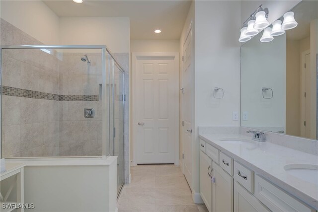 2337 Tangerine Ln, Naples, FL 34120 - full bathroom with double vanity, a shower stall, recessed lighting, a chandelier, and tile patterned flooring
