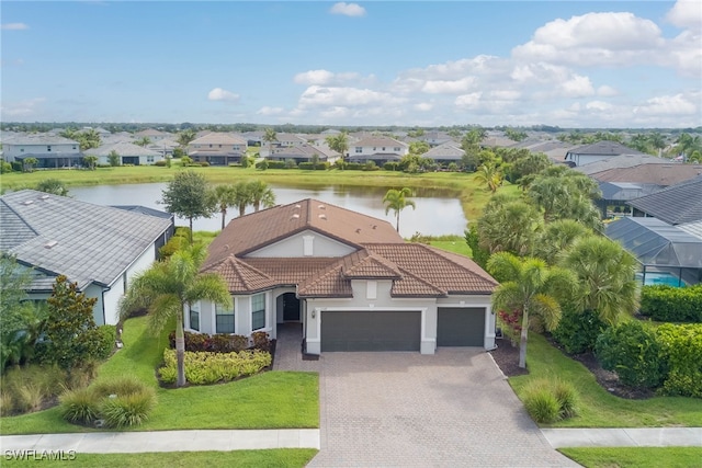 2337 Tangerine Ln, Naples, FL 34120 - view of front of house with a residential view, an attached garage, a water view, and driveway