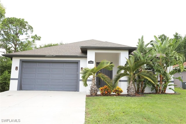 12083 Maiden Ln, Bonita Springs, FL 34135 - view of front facade featuring driveway, stucco siding, a front lawn, a garage, and a shingled roof