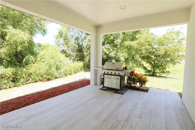 12083 Maiden Ln, Bonita Springs, FL 34135 - wooden terrace featuring a patio area