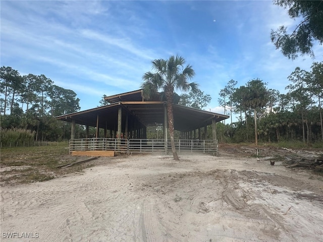 3550 Everglades Blvd S, Naples, FL 34117 - view of front of property featuring an exterior structure and an outdoor structure