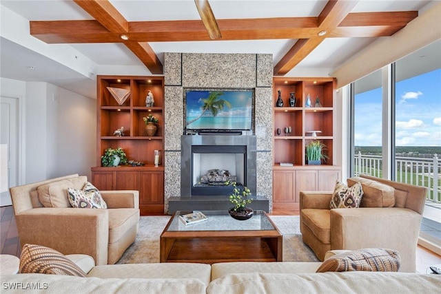 13675 Vanderbilt Dr Ph 1105, Naples, FL 34110 - living area with coffered ceiling, a tile fireplace, built in features, beam ceiling, and wood finished floors