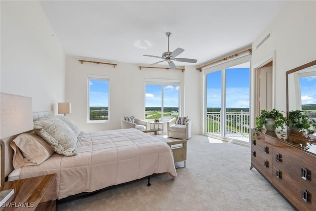 13675 Vanderbilt Dr Ph 1105, Naples, FL 34110 - bedroom with access to outside, multiple windows, light carpet, and ceiling fan