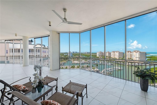 13675 Vanderbilt Dr Ph 1105, Naples, FL 34110 - sunroom / solarium featuring a water view and healthy amount of natural light