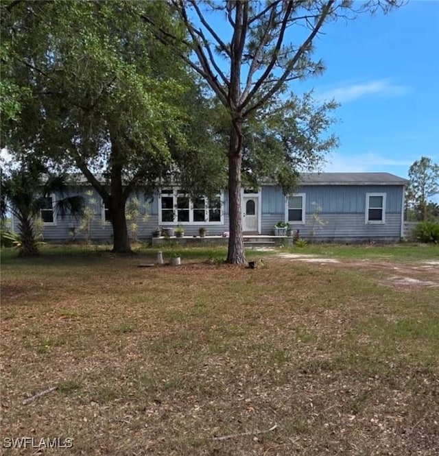 4660 43rd Ave NE, Naples, FL 34120 - view of front facade with a front yard