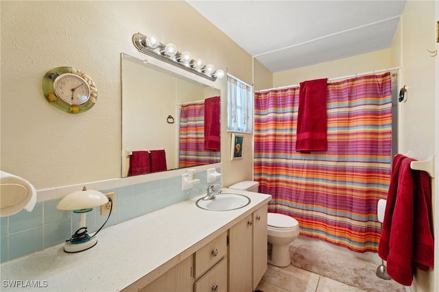 1415 Tropic Ter Unit 1415, North Fort Myers, FL 33903 - full bath with toilet, tasteful backsplash, vanity, tile patterned floors, and curtained shower