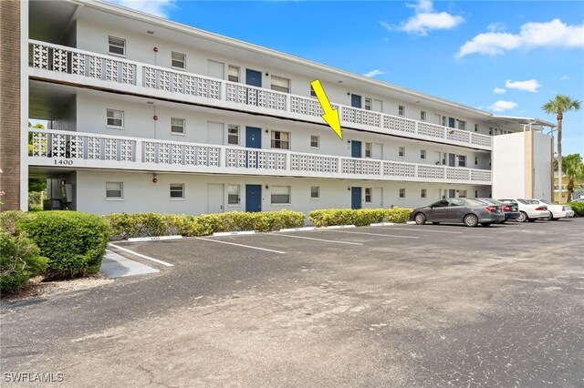 1415 Tropic Ter Unit 1415, North Fort Myers, FL 33903 - view of property featuring uncovered parking