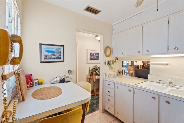1415 Tropic Ter Unit 1415, North Fort Myers, FL 33903 - kitchen featuring a sink, light countertops, and light tile patterned floors