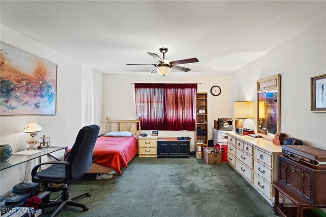 1415 Tropic Ter Unit 1415, North Fort Myers, FL 33903 - bedroom featuring dark colored carpet, a desk, and ceiling fan