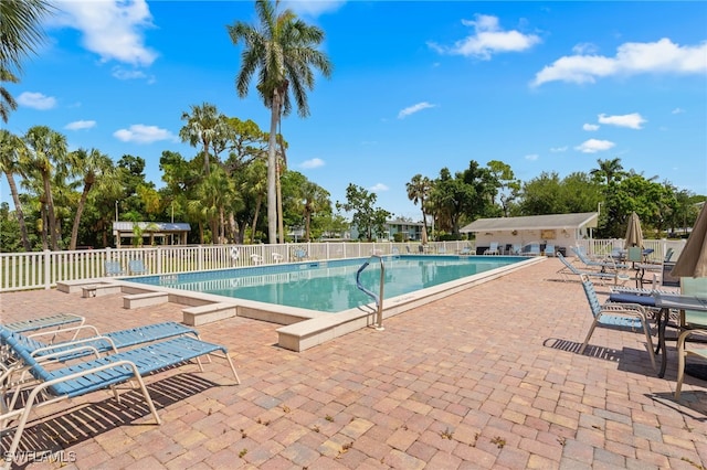1415 Tropic Ter Unit 1415, North Fort Myers, FL 33903 - community pool featuring a patio area and view of scattered trees