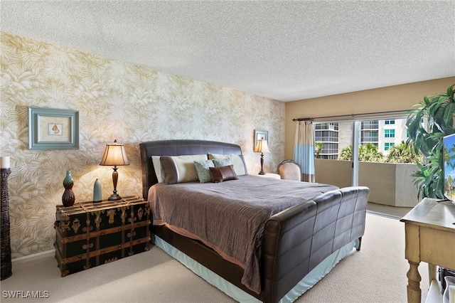 1036 S Collier Blvd Unit A103, Marco Island, FL 34145 - bedroom featuring wallpapered walls, access to outside, a textured ceiling, and carpet floors