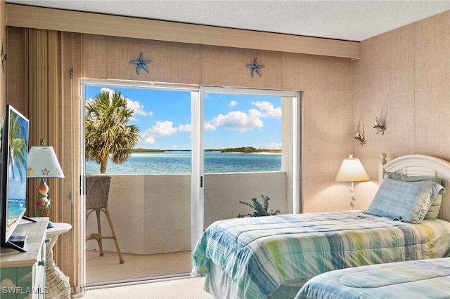 1036 S Collier Blvd Unit A103, Marco Island, FL 34145 - tiled bedroom with a water view, multiple windows, and access to exterior