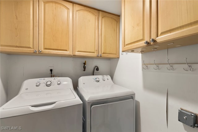 1036 S Collier Blvd Unit A103, Marco Island, FL 34145 - washroom featuring independent washer and dryer and cabinet space