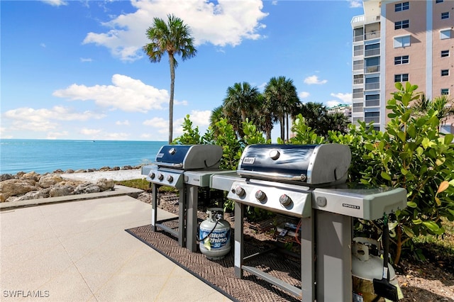 1036 S Collier Blvd Unit A103, Marco Island, FL 34145 - view of patio / terrace featuring area for grilling and a water view