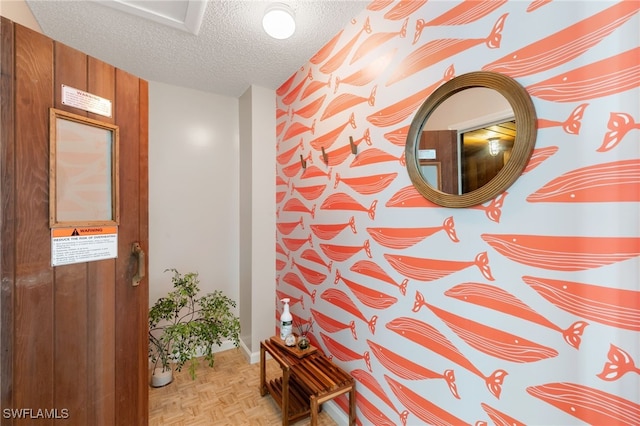 1036 S Collier Blvd Unit A103, Marco Island, FL 34145 - hall featuring a textured ceiling and baseboards