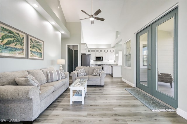910 Gen George Patton Ave, Labelle, FL 33935 - living area with a ceiling fan, light wood-type flooring, high vaulted ceiling, baseboards, and recessed lighting