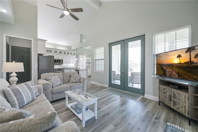 910 Gen George Patton Ave, Labelle, FL 33935 - living area featuring french doors, a ceiling fan, high vaulted ceiling, baseboards, and light wood-style floors