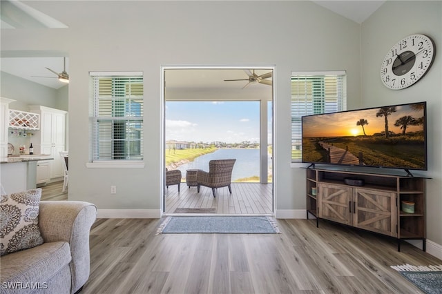 910 Gen George Patton Ave, Labelle, FL 33935 - living room with a ceiling fan, vaulted ceiling, plenty of natural light, and light wood-style floors