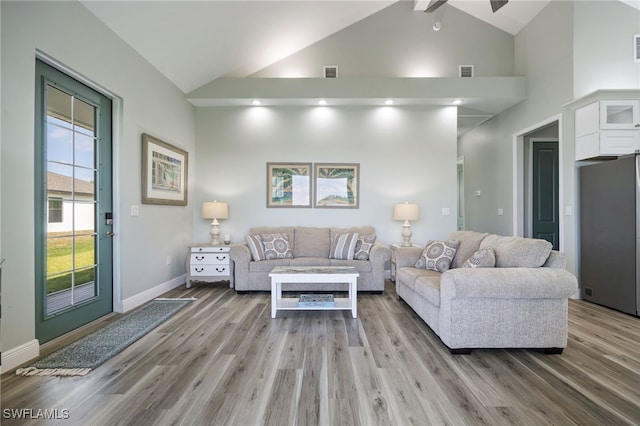 910 Gen George Patton Ave, Labelle, FL 33935 - living area with light wood finished floors, high vaulted ceiling, baseboards, and ceiling fan