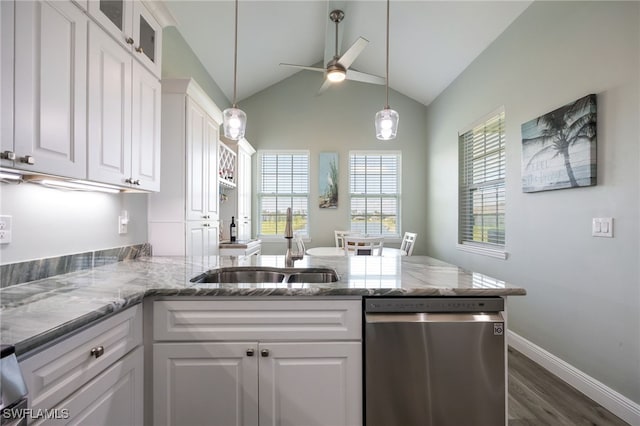 910 Gen George Patton Ave, Labelle, FL 33935 - kitchen featuring dishwasher, a peninsula, white cabinetry, a ceiling fan, and vaulted ceiling