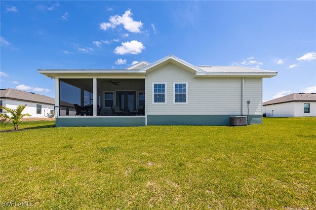 910 Gen George Patton Ave, Labelle, FL 33935 - back of house with a sunroom, a lawn, ceiling fan, and metal roof