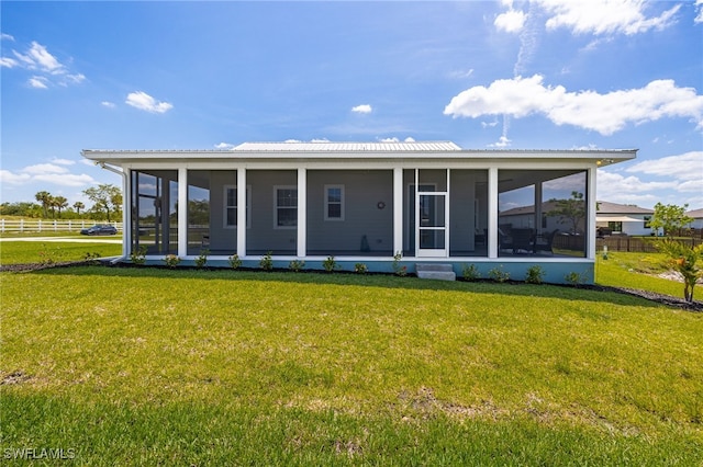 910 Gen George Patton Ave, Labelle, FL 33935 - rear view of house featuring a sunroom and metal roof