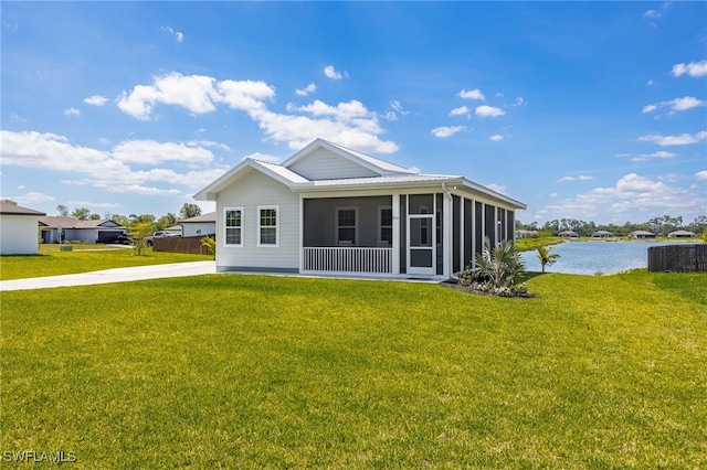 910 Gen George Patton Ave, Labelle, FL 33935 - back of house with a sunroom, a water view, and a yard