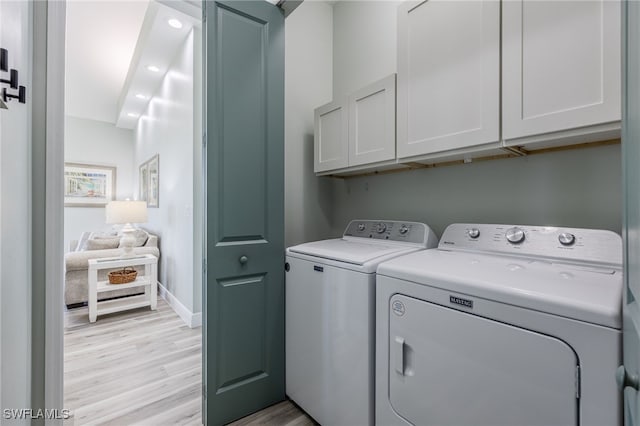 910 Gen George Patton Ave, Labelle, FL 33935 - laundry area with washing machine and dryer, cabinet space, light wood-type flooring, baseboards, and recessed lighting