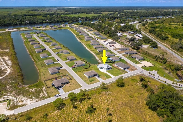 910 Gen George Patton Ave, Labelle, FL 33935 - aerial overview of property's location with a nearby body of water and nearby suburban area