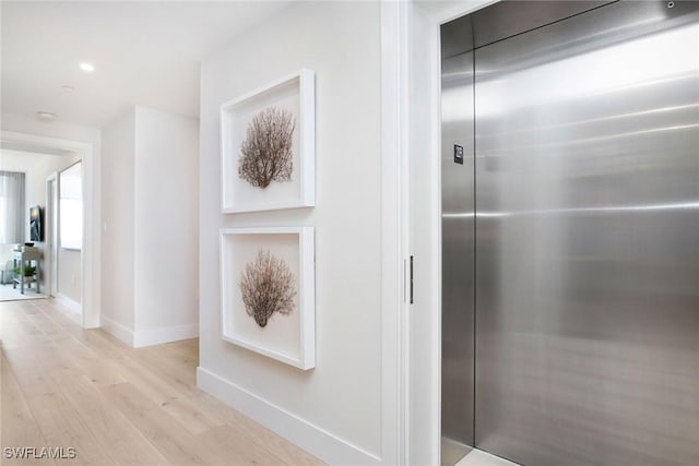 13945 Old Coast Rd Unit 2204, Naples, FL 34110 - corridor featuring elevator, light wood-style floors, and recessed lighting