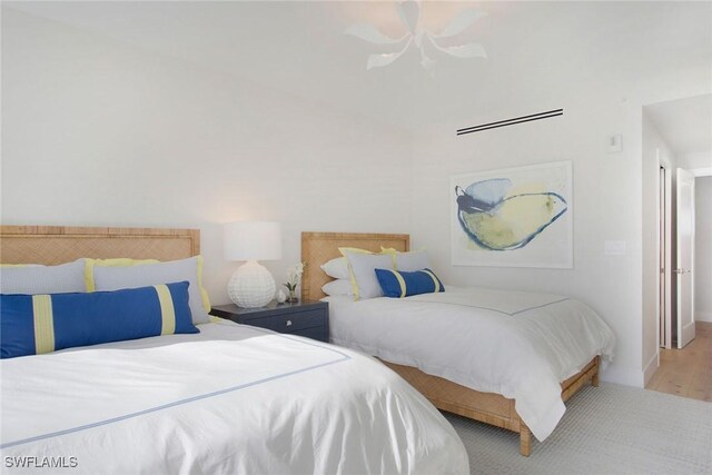 13945 Old Coast Rd Unit 2204, Naples, FL 34110 - bedroom featuring wood finished floors and ceiling fan