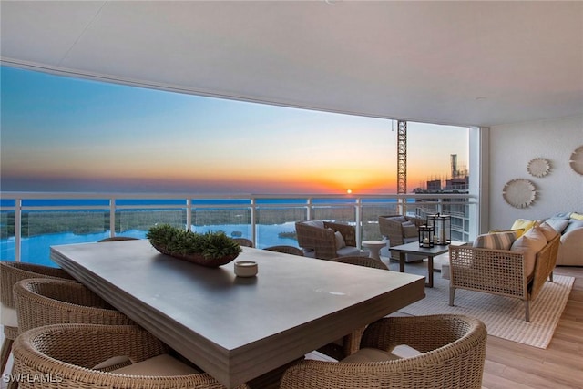 13945 Old Coast Rd Unit 2204, Naples, FL 34110 - balcony featuring a water view, outdoor dining area, and outdoor lounge area