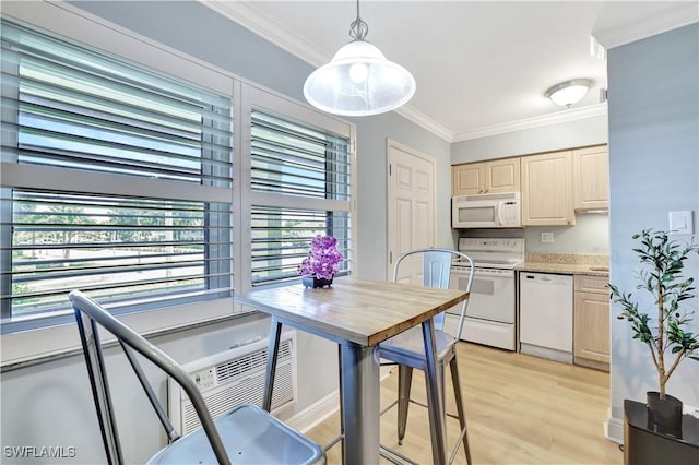 130 N Collier Blvd Unit A7, Marco Island, FL 34145 - kitchen with white appliances, crown molding, light wood finished floors, hanging light fixtures, and light brown cabinets