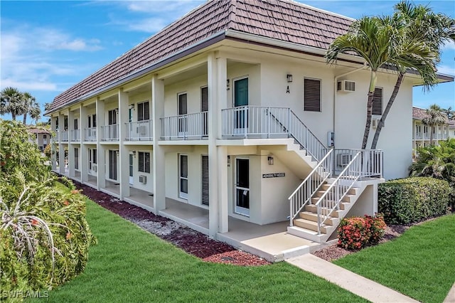 130 N Collier Blvd Unit A7, Marco Island, FL 34145 - view of building exterior with stairs