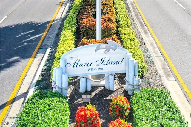 130 N Collier Blvd Unit A7, Marco Island, FL 34145 - community / neighborhood sign featuring uncovered parking