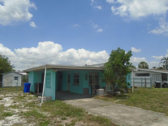 2956 Powell St, Fort Myers, FL 33901 - view of front of house featuring an attached carport and driveway