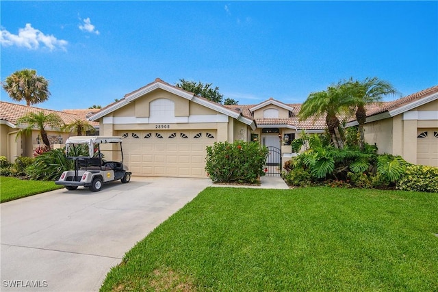28908 Marsh Elder Ct, Bonita Springs, FL 34135 - ranch-style home featuring a tile roof, stucco siding, an attached garage, concrete driveway, and a front lawn