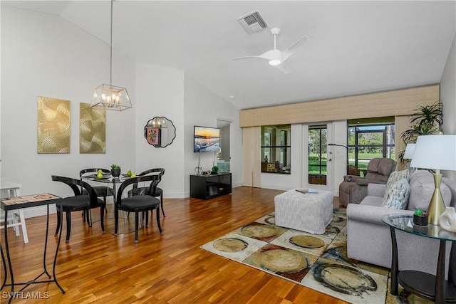 28908 Marsh Elder Ct, Bonita Springs, FL 34135 - living room with wood finished floors, high vaulted ceiling, a ceiling fan, a chandelier, and baseboards