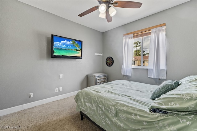 15120 Piping Plover Ct Unit 102, North Fort Myers, FL 33917 - carpeted bedroom featuring baseboards and ceiling fan