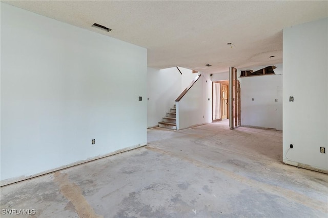8172 Sanibel Blvd, Fort Myers, FL 33967 - unfurnished room featuring concrete floors and stairway