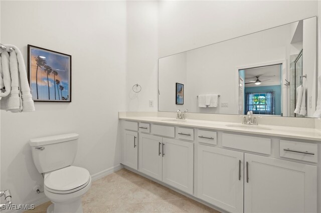 15960 Grassland Ln Unit 2726, Punta Gorda, FL 33982 - full bathroom featuring double vanity, toilet, baseboards, a shower with door, and tile patterned flooring