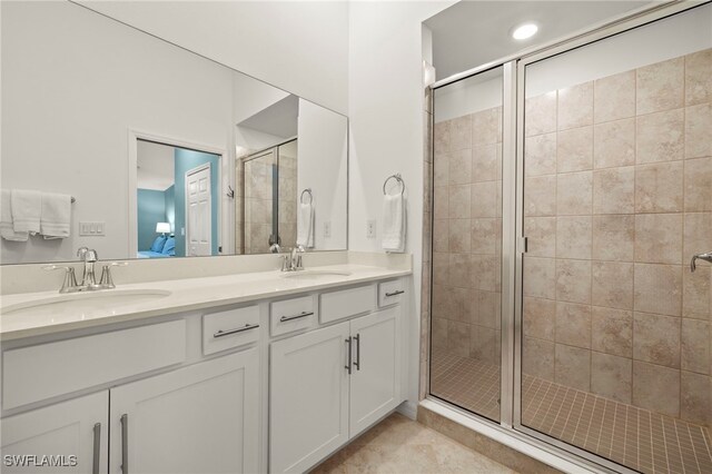 15960 Grassland Ln Unit 2726, Punta Gorda, FL 33982 - bathroom featuring a stall shower, double vanity, connected bathroom, and tile patterned floors