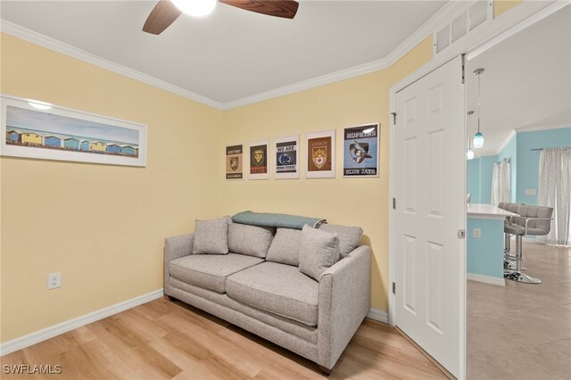 15960 Grassland Ln Unit 2726, Punta Gorda, FL 33982 - living area with a ceiling fan, crown molding, and baseboards