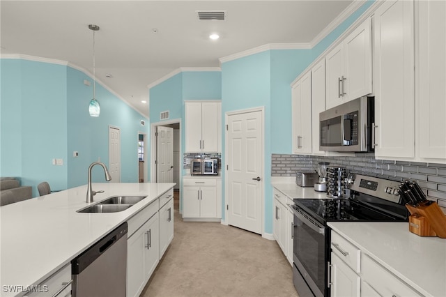 15960 Grassland Ln Unit 2726, Punta Gorda, FL 33982 - kitchen with appliances with stainless steel finishes, a sink, crown molding, white cabinetry, and light countertops