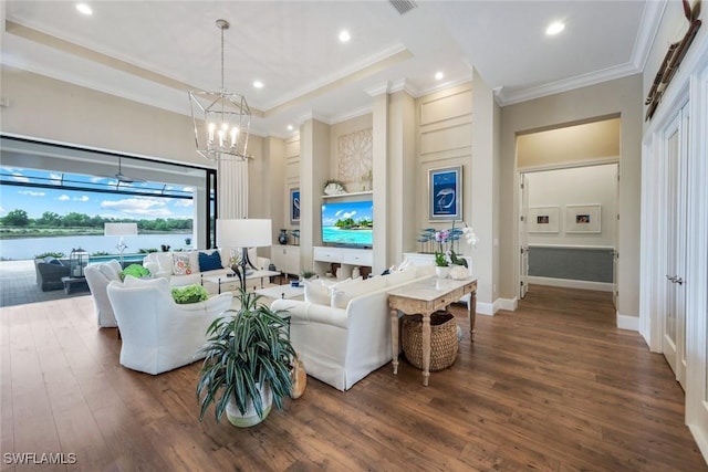 9010 Arrezo Ct, Naples, FL 34119 - living room featuring hardwood / wood-style flooring, crown molding, a chandelier, and recessed lighting