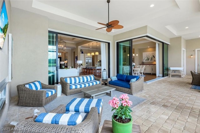 9010 Arrezo Ct, Naples, FL 34119 - view of patio with an outdoor living space and ceiling fan